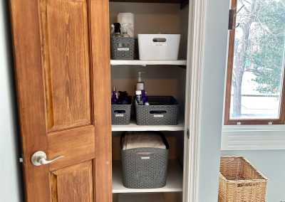 bathroom linen closet nearly organized
