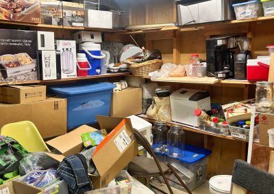 basement shelves filled and overflowing with boxes and junk